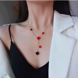 New 18k Rose Gold long 4 leaf clover stainless steel necklace.